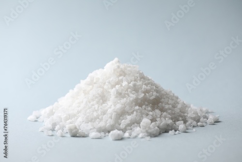 Heap of natural salt on color background
