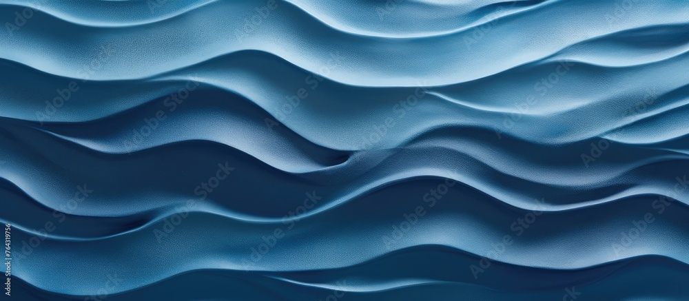 A detailed shot showing the intricate blue wave design painted on a wall surface