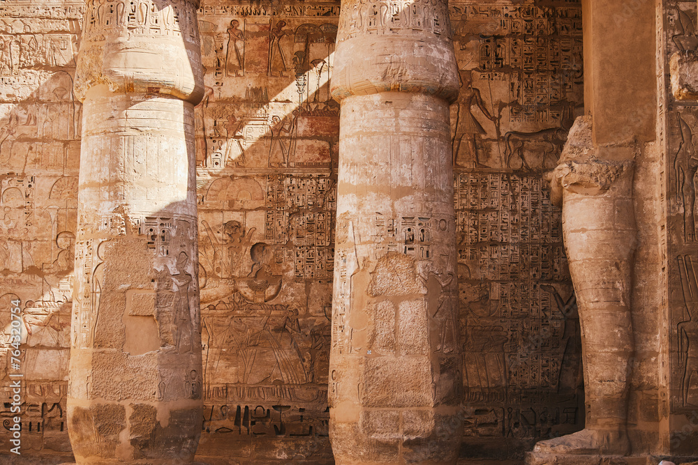Columns with Egyptian hieroglyphs and ancient symbols. Famous Egyptian landmark. Visiting ancient Egypt
