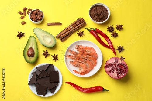 Natural aphrodisiac. Different products on yellow background, flat lay