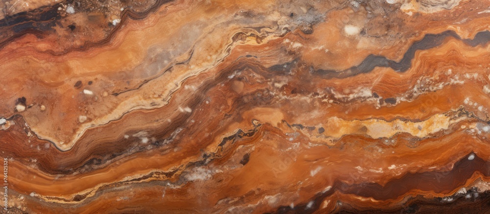 An up-close view of a large slab of marble featuring a striking pattern of brown and white colors