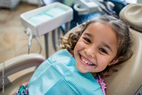 A little girl sitting in a dentist chair smiling. Generative AI.