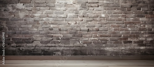 A detailed view of a brick wall in close proximity to a wooden floor