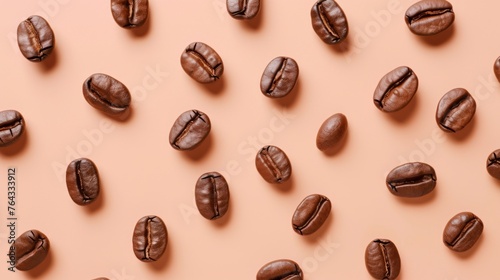 Roasted coffee beans in geometry location on peach background. Coffee beans in rich brown hues scattered on a soft peach background, creating an elegant pattern with varying orientations. Warm and