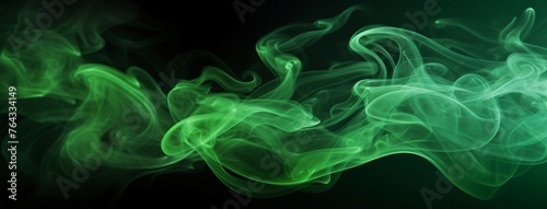 Abstract green smoke moves on black background. Blue fog on the empty dark scene, studio room with mist