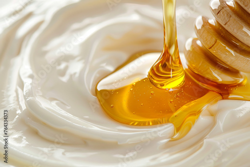 smooth texture of liquid melted honey and milk cream, poured onto the surface