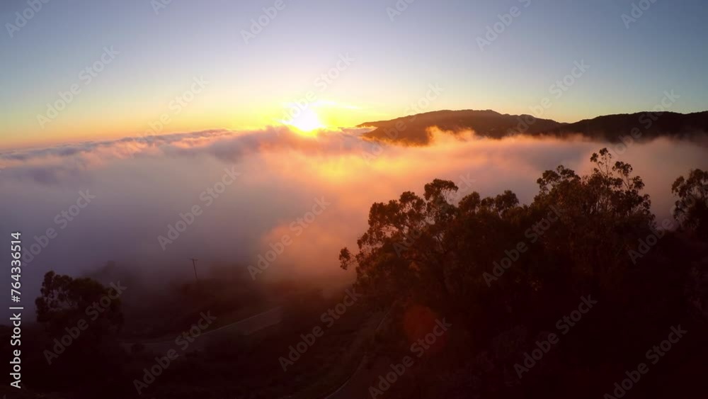 Aerial Backward Shot Of Tranquil Clouds Moving On Mountains During Scenic Sunset - Pismo Beach, California Aerial Backward Shot Of Tranquil Clouds Moving On Mountains During Scenic Sunset - Pismo Beach, California