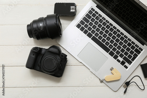 Composition with modern gadgets on light wooden background