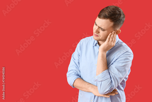 Young man suffering from ea...