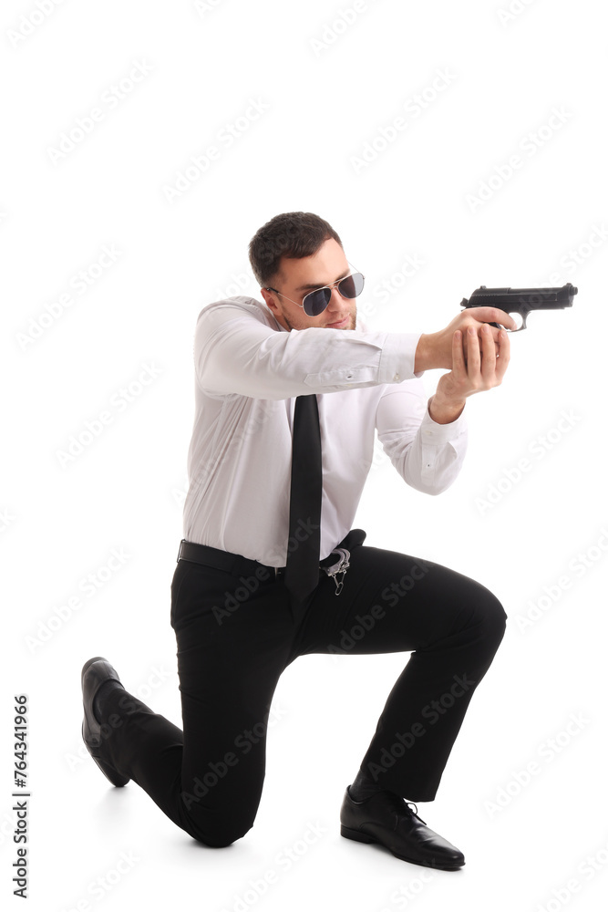 Male police officer with weapon on white background Male police officer with weapon on white background