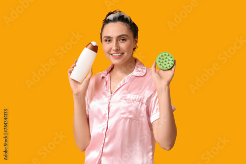 Smiling woman with shampoo ...