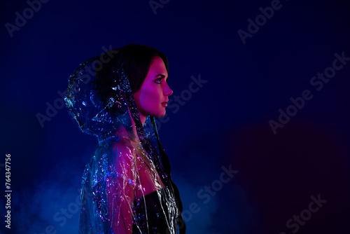 Photo of stunning girl dressed rubber plastic transparent waterpoof jacket look dark blue empty space advert photo