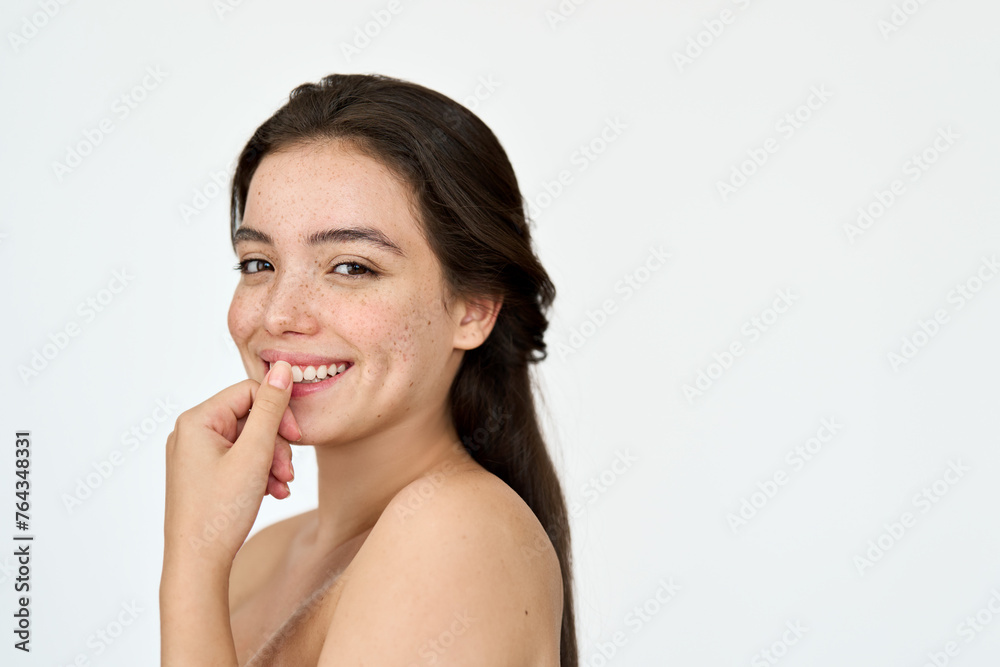 Happy smiling Latin girl model with freckles on face looking at camera isolated on white background advertising skin care product, skincare cosmetic dermatology treatment, beauty aesthetic portrait. Happy smiling Latin girl model with freckles on face looking at camera isolated on white background advertising skin care product, skincare cosmetic dermatology treatment, beauty aesthetic portrait.