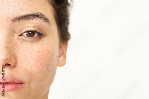 Konstfotografi Close up aesthetic beauty half face portrait of Latin girl isolated on white background