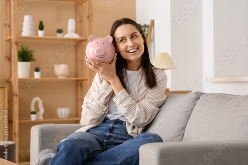 Pretty young woman with pig...