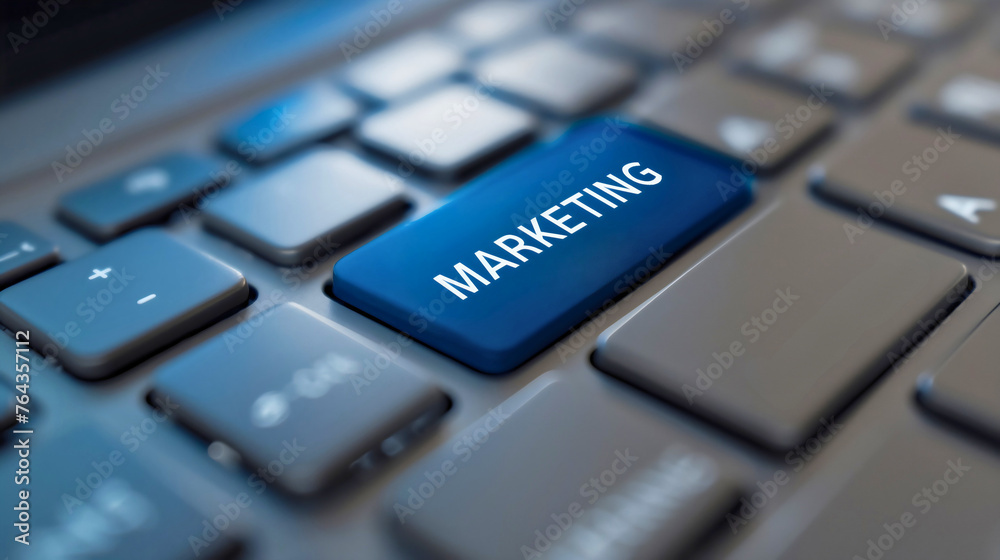 Closeup of blue marketing key on grey laptop keyboard. Digital business technology and communication concept, social internet advertising on the online network, website product success campaign Closeup of blue marketing key on grey laptop keyboard. Digital business technology and communication concept, social internet advertising on the online network, website product success campaign