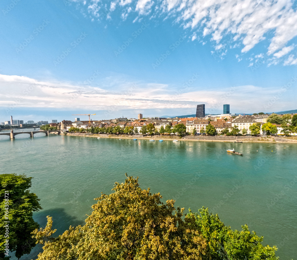 Aerial views of the beautiful European city of Basel, Switzerland. The Rhine River is in the forefront of view. Mittlere Brücke (Middle Bridge) can be seen in the distance.