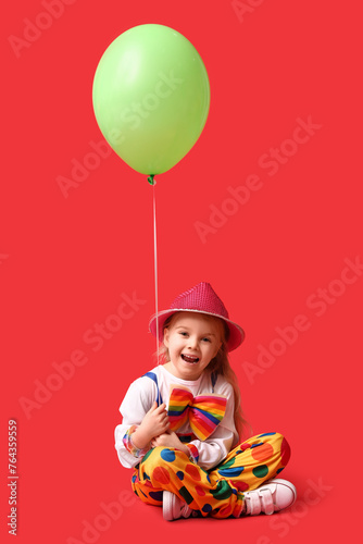 Funny little girl in clown ...