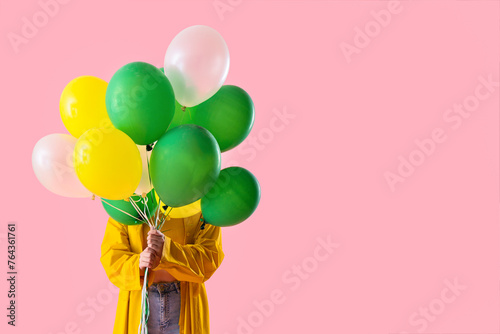 Young woman in raincoat wit...