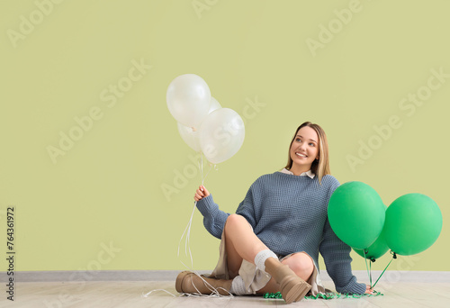 Young woman with balloons s...