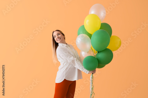 Young woman with balloons o...