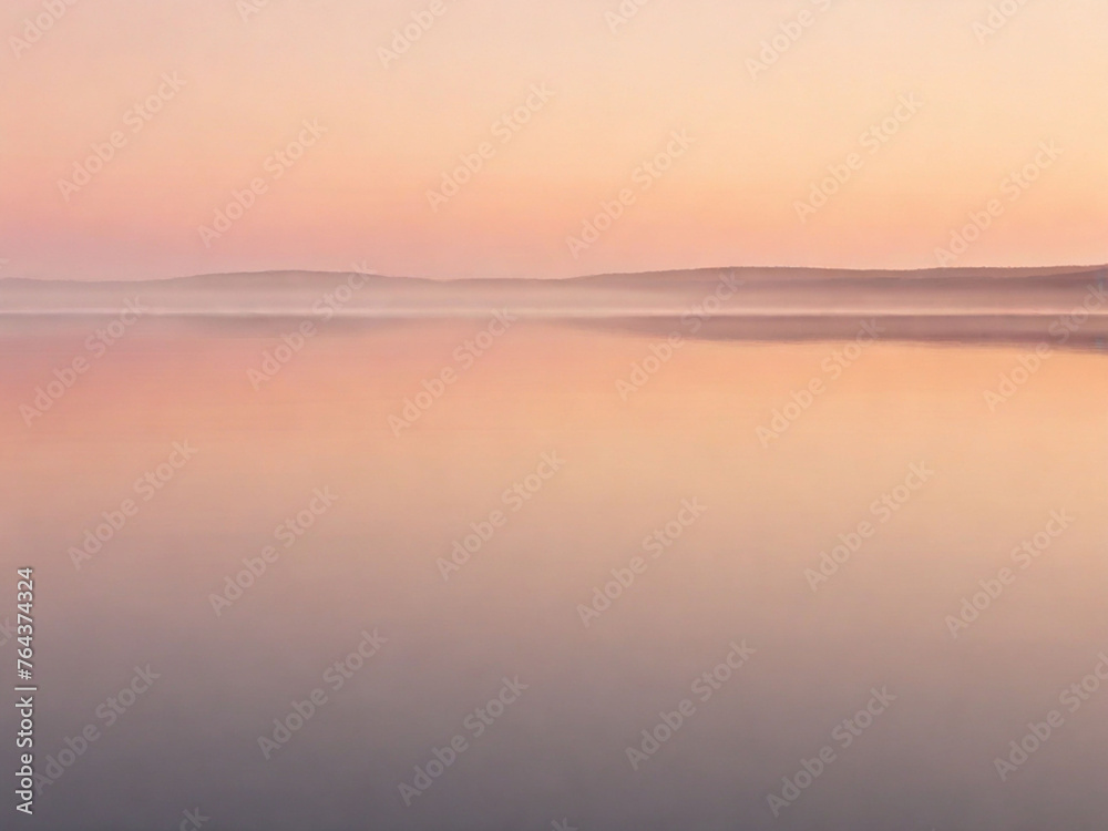 the sky a gradient of soft oranges and pinks, reflected in the still waters of a solitary lake