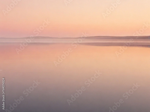 the sky a gradient of soft oranges and pinks  reflected in the still waters of a solitary lake
