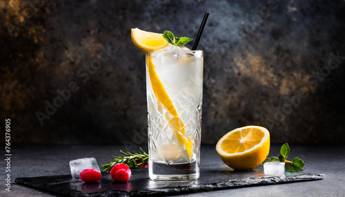 tom collins cocktail in large glass on dark background photo