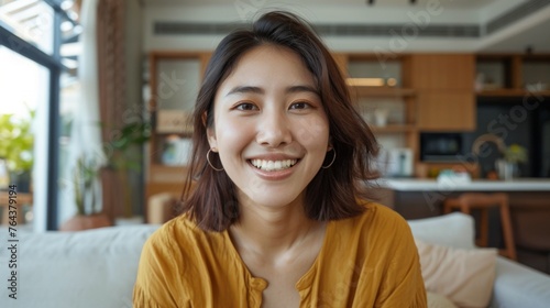 Woman is taking a selfie in her apartment photo