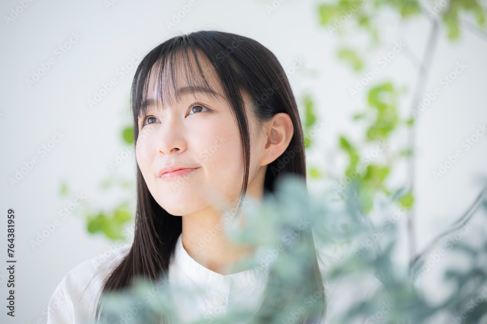 Young Asian (Japanese) woman in her 20s beauty beauty beauty image looking up Young Asian (Japanese) woman in her 20s beauty beauty beauty image looking up