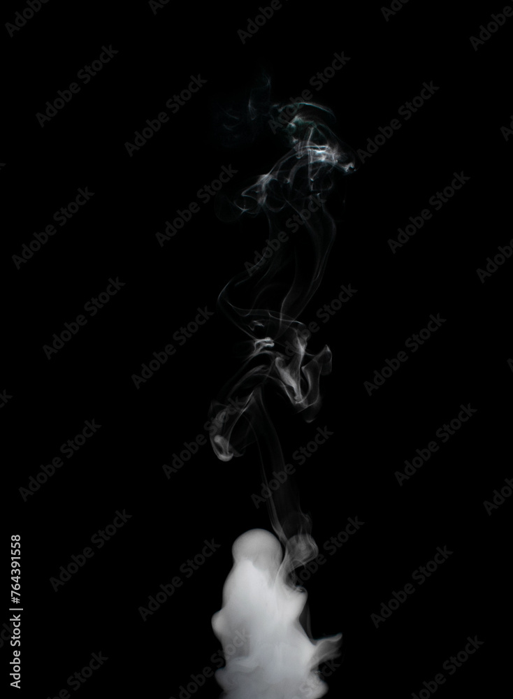 White puffs of smoke on a black background float mixing in bizarre chaotic patterns of thin threads White puffs of smoke on a black background float mixing in bizarre chaotic patterns of thin threads