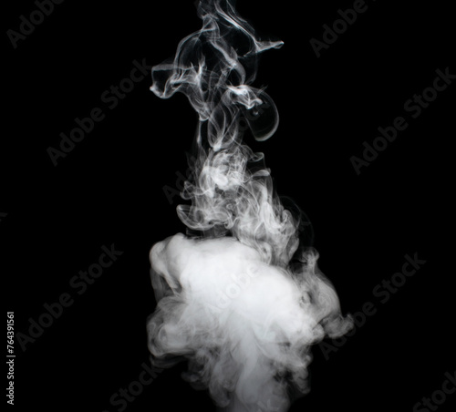 White puffs of smoke on a black background float mixing in bizarre chaotic patterns of thin threads