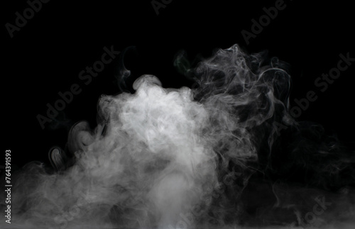 White puffs of smoke on a black background float mixing in bizarre chaotic patterns of thin threads