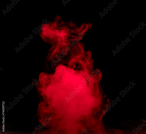 Abstract background of chaotically mixing puffs of red smoke on a dark background
