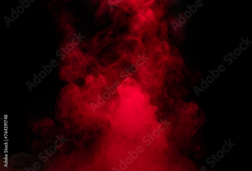 Abstract background of chaotically mixing puffs of red smoke on a dark background