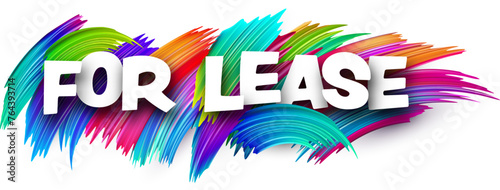 For lease paper word sign with colorful spectrum paint brush strokes over white.