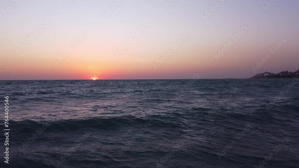 High sea wave surfing water sport adventure travel to visit ocean landscape sunset blue pink twilight aerial drone shot fly over sea waves skyline horizon peaceful gulf Qatar tourism attraction resort High sea wave surfing water sport adventure travel to visit ocean landscape sunset blue pink twilight aerial drone shot fly over sea waves skyline horizon peaceful gulf Qatar tourism attraction resort