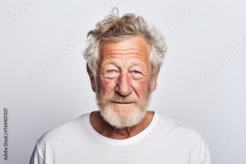 Portrait of an old man with a funny expression on his face © Iigo