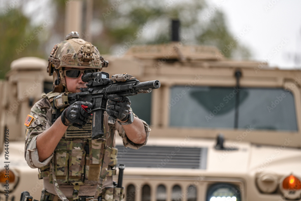 Confident soldier in full gear stands before a military vehicle, rifle in hand, showcasing readiness and strength. Confident soldier in full gear stands before a military vehicle, rifle in hand, showcasing readiness and strength.