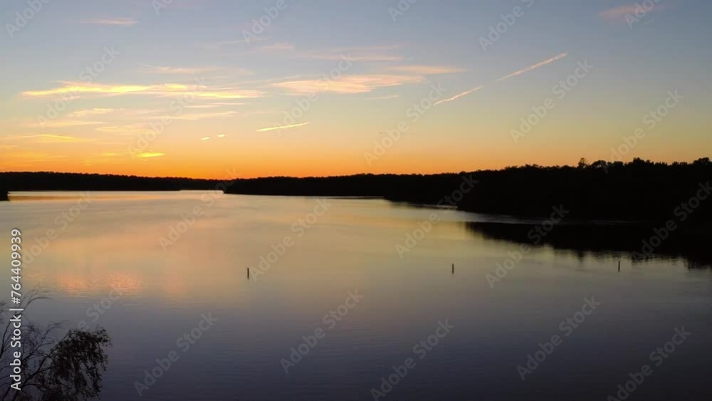 Aerial: Drone Panning Idyllic View Of Tranquil Rippled River During Sunset - Buckner, California
