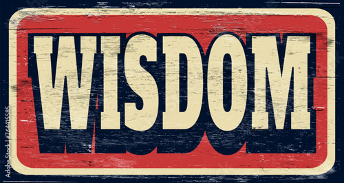 Aged and worn wisdom sign on wood.
