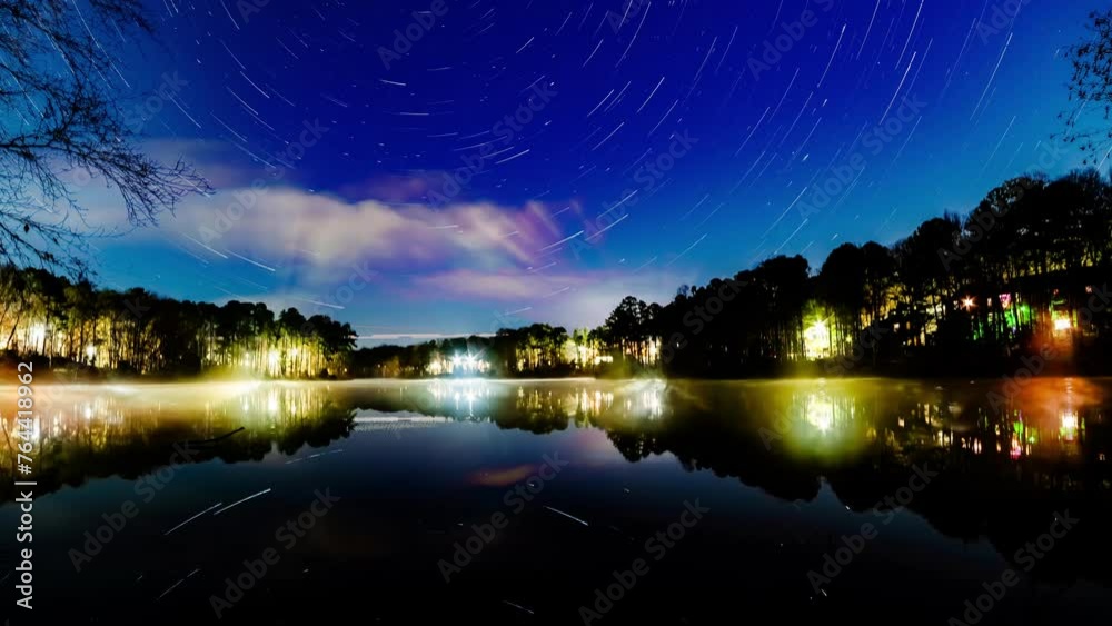 Psychedelic Creation of Star Trails over a lake in the city timelapse. Psychedelic Creation of Star Trails over a lake in the city timelapse.
