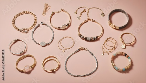 A flat lay featuring a curated assortment of bracelets, including bangles, cuffs, and delicate chain designs.