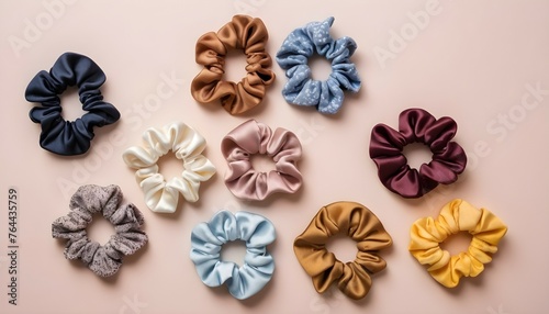 A top view of trendy hair scrunchies in various colors and fabrics, adding a playful touch to hairstyles.