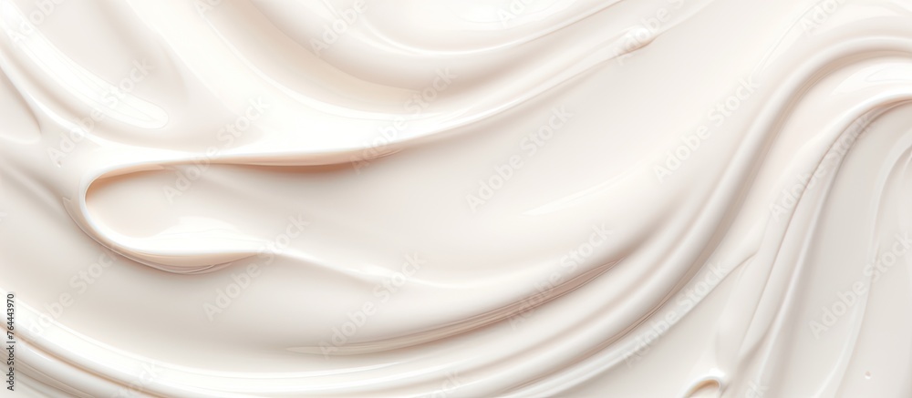 Obraz premium An up-close view of a white liquid with a swirling pattern captured in the image