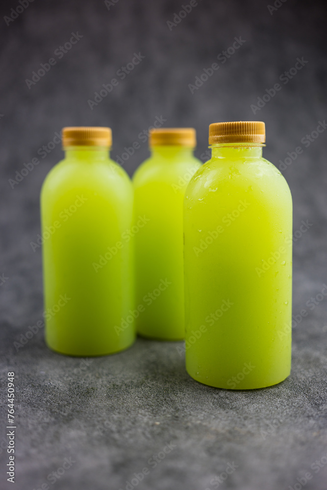 Guava juice in plastic bottle with golden lid Guava juice in plastic bottle with golden lid
