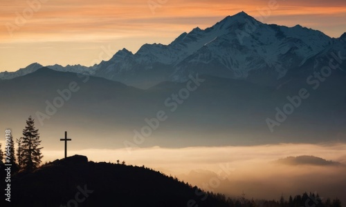 black silhouette of mountains alps, hills, forest and cross / summit cross, in the evening during the sunset, with orange colored sky