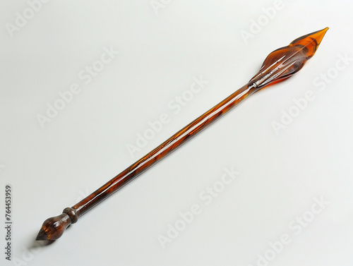 An ancient spear its long shaft and pointed tip transitioning into a detailed glass melt