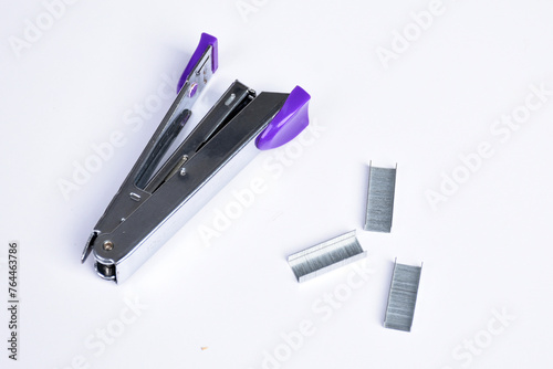 Metallic color stapler or staples isolated on a white background