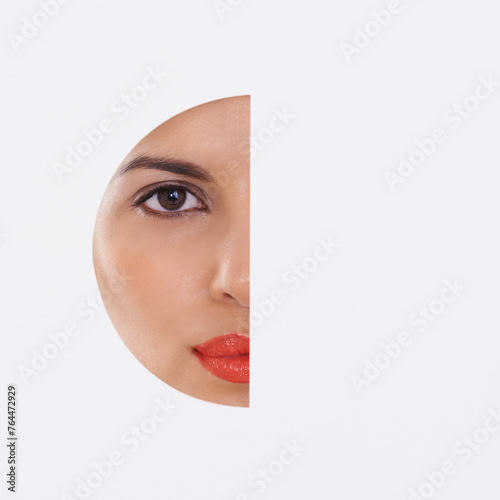 Woman, face and beauty in a cutout and studio for cosmetics, skincare and dermatology. Portrait of a young model with makeup, foundation and art deco, closeup or mockup space on a white background © Mariusz S/peopleimages.com